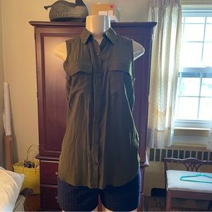 Sleeveless long waisted button down.  Express calls it THE CITY SHIRT.  Flirty